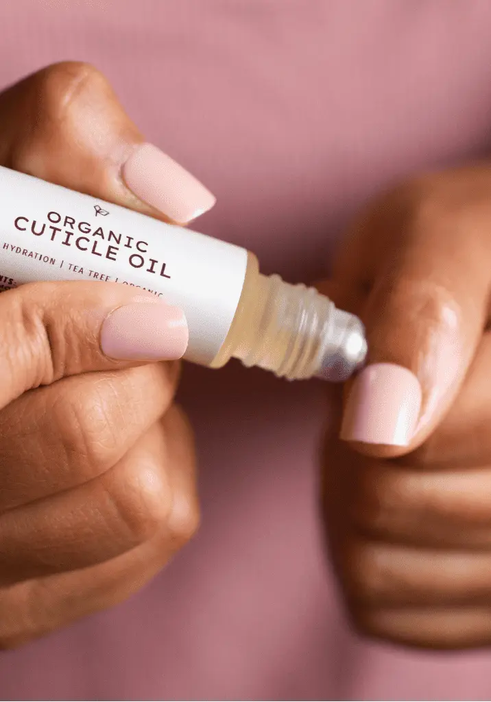Sanbe Beauty organic cuticle oil applied to nails – hydrating nail care for healthy cuticles