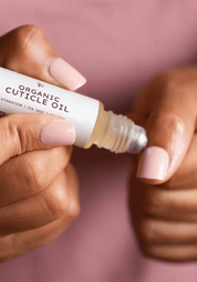 Sanbe Beauty organic cuticle oil applied to nails – hydrating nail care for healthy cuticles